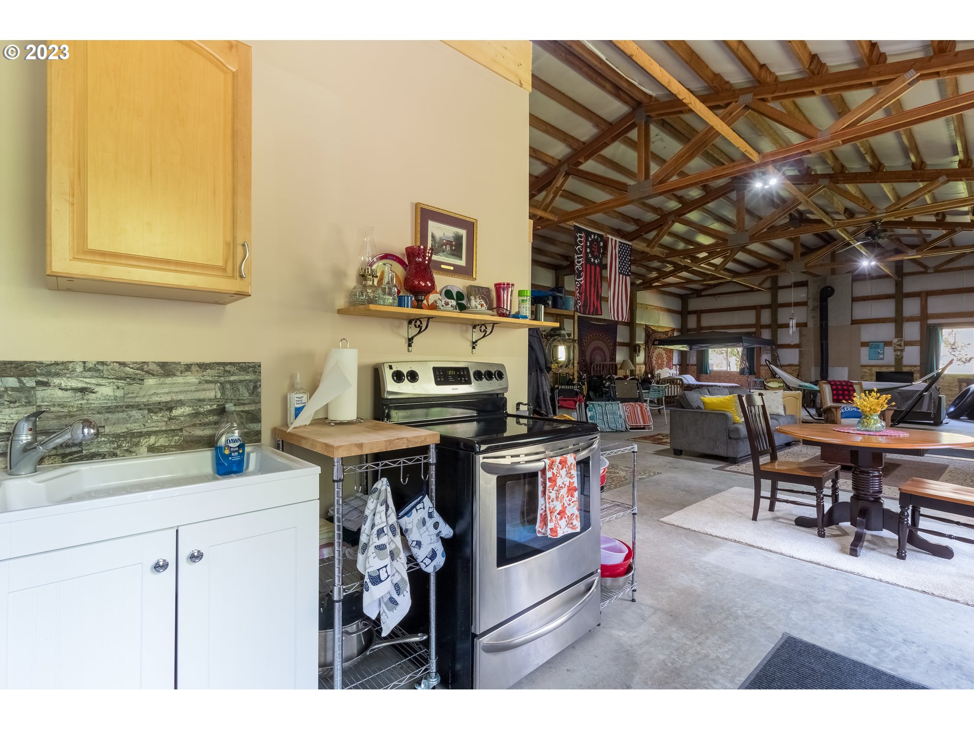 61174 Mill Creek Road Milton Freewater, OR 97862 - Photo 18 of 25 a kitchen with stainless steel appliances granite countertop a stove a sink and a microwave
