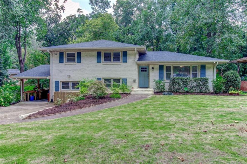2931 Santa Monica Drive Decatur, GA 30032 - Photo 1 of 1 a front view of a house with a garden