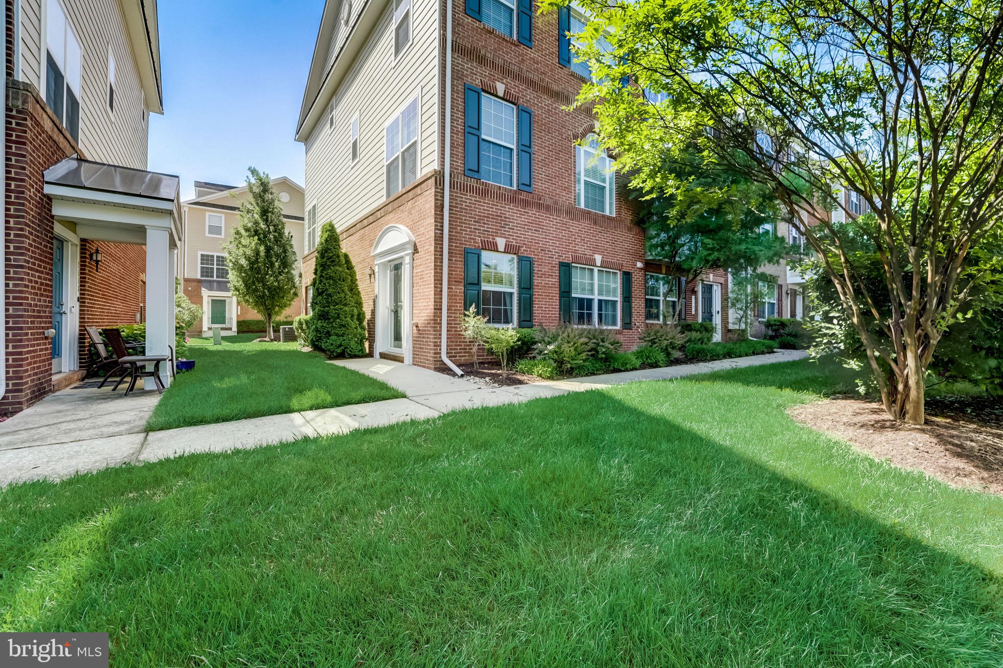 2558 Cherry Tree Road Hanover, MD 21076 - Photo 1 of 37 a view of a brick building next to a yard