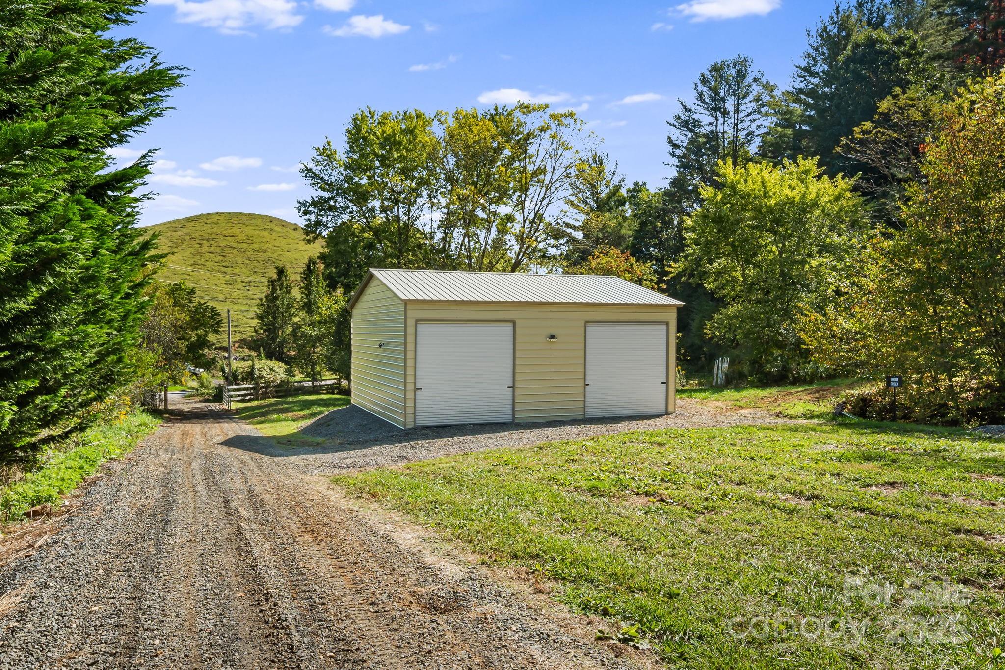 0 Maney Br Road Burnsville, NC 28714 - Photo 2 of 48 a view of a garage with a tree