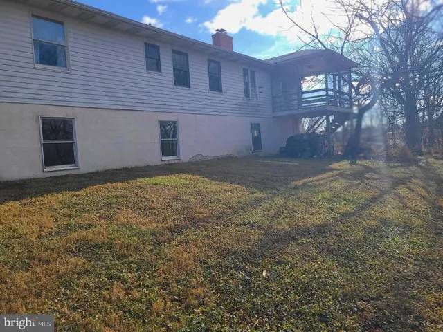 a view of a backyard of the house