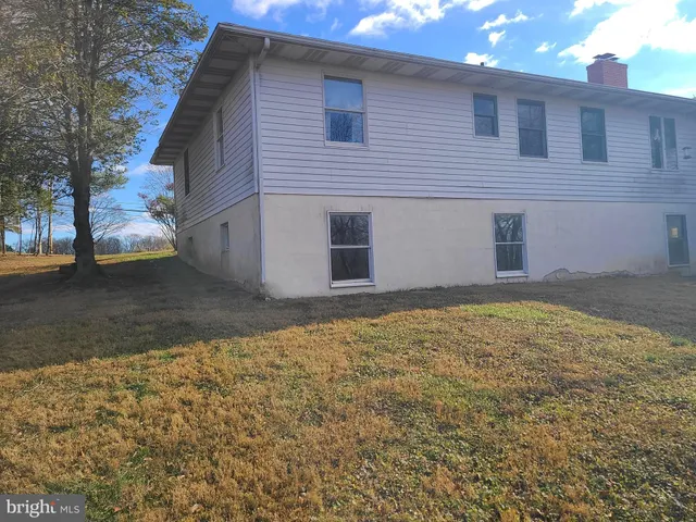 a view of a backyard of the house