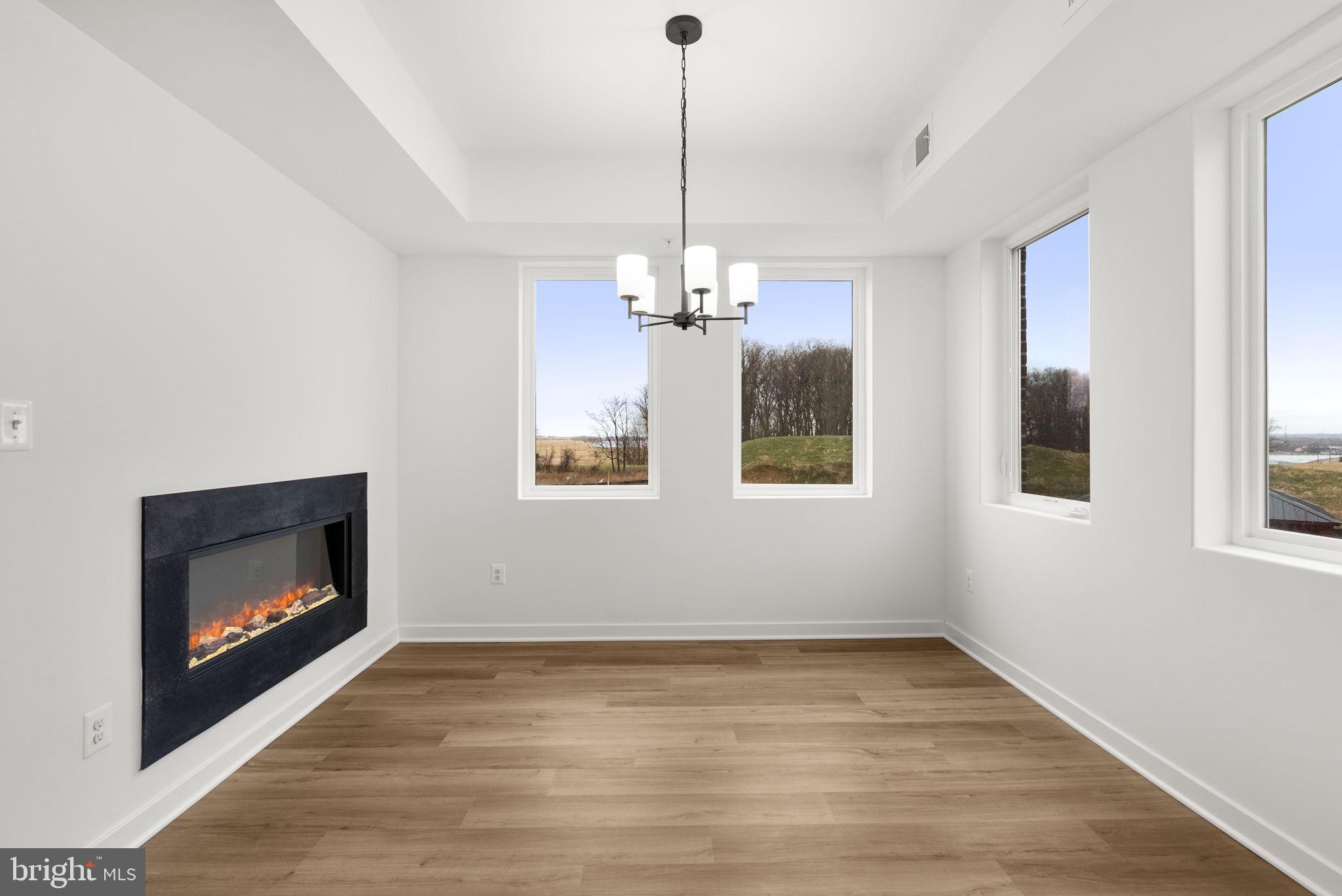 1631 Blacksmith Way, Unit 214B Frederick, MD 21702 - Photo 15 of 41 a room with window and fireplace