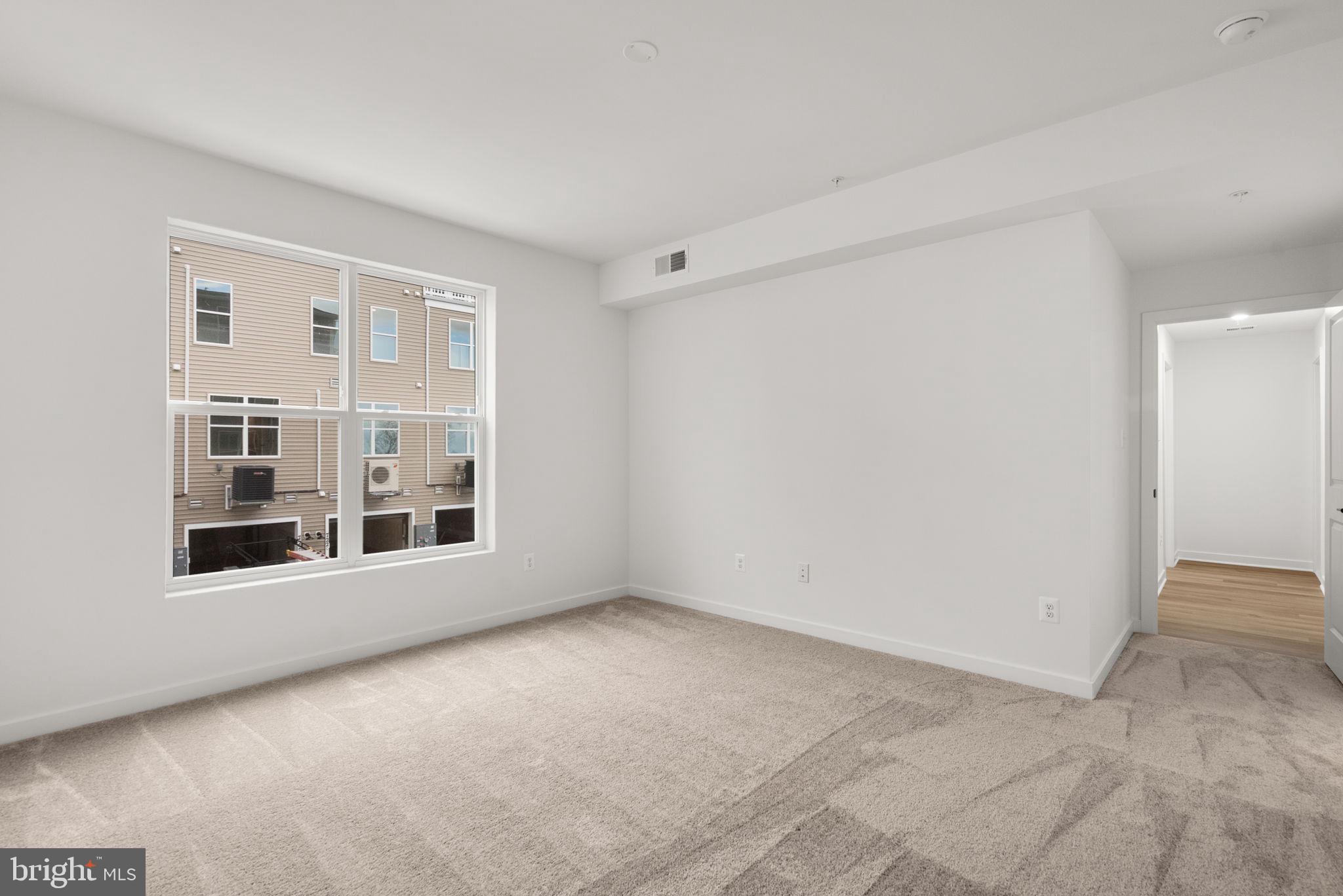 1631 Blacksmith Way, Unit 214B Frederick, MD 21702 - Photo 22 of 41 a view of empty room with windows