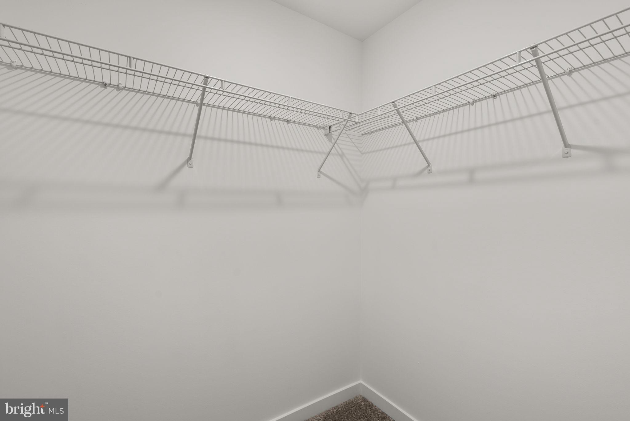 1631 Blacksmith Way, Unit 214B Frederick, MD 21702 - Photo 27 of 41 a view of a room with racks on the wall