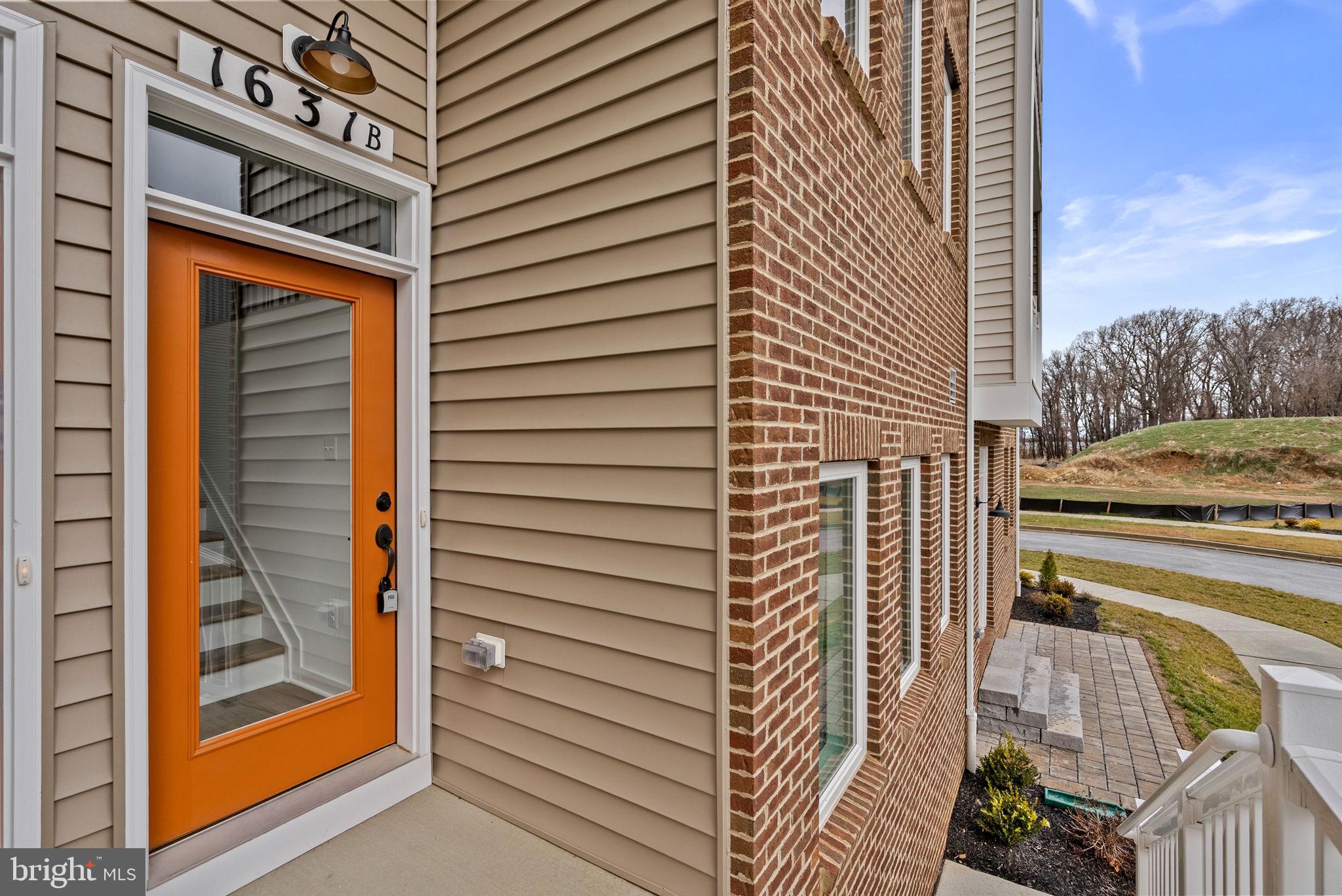 1631 Blacksmith Way, Unit 214B Frederick, MD 21702 - Photo 3 of 41 a view of balcony and door