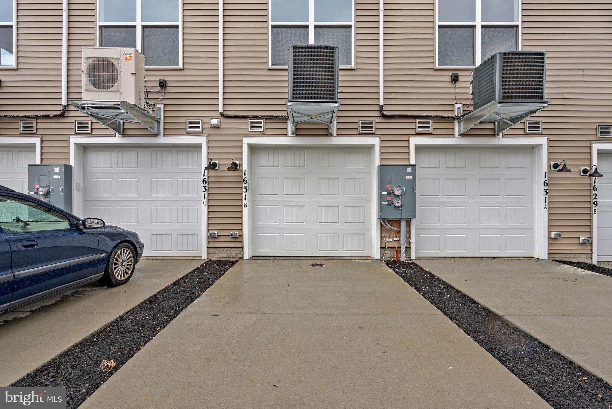 1631 Blacksmith Way, Unit 214B Frederick, MD 21702 - Photo 38 of 41 a view of a car park in front of a house