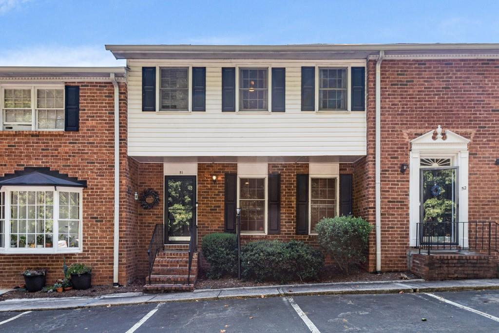 6520 Roswell Road, Unit 51 Atlanta, GA 30328 - Photo 1 of 1 front view of a brick house with a large window