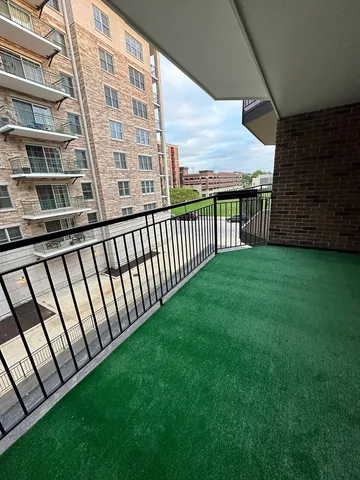 a view of a back yard from a balcony