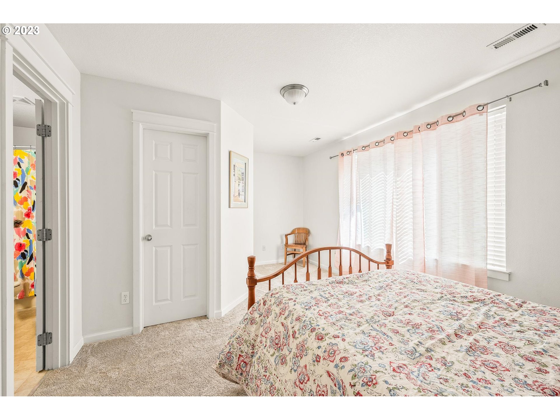 2830 Northeast Blossom Hill Road Fairview, OR 97024 - Photo 13 of 34 a bedroom with a bed and a window