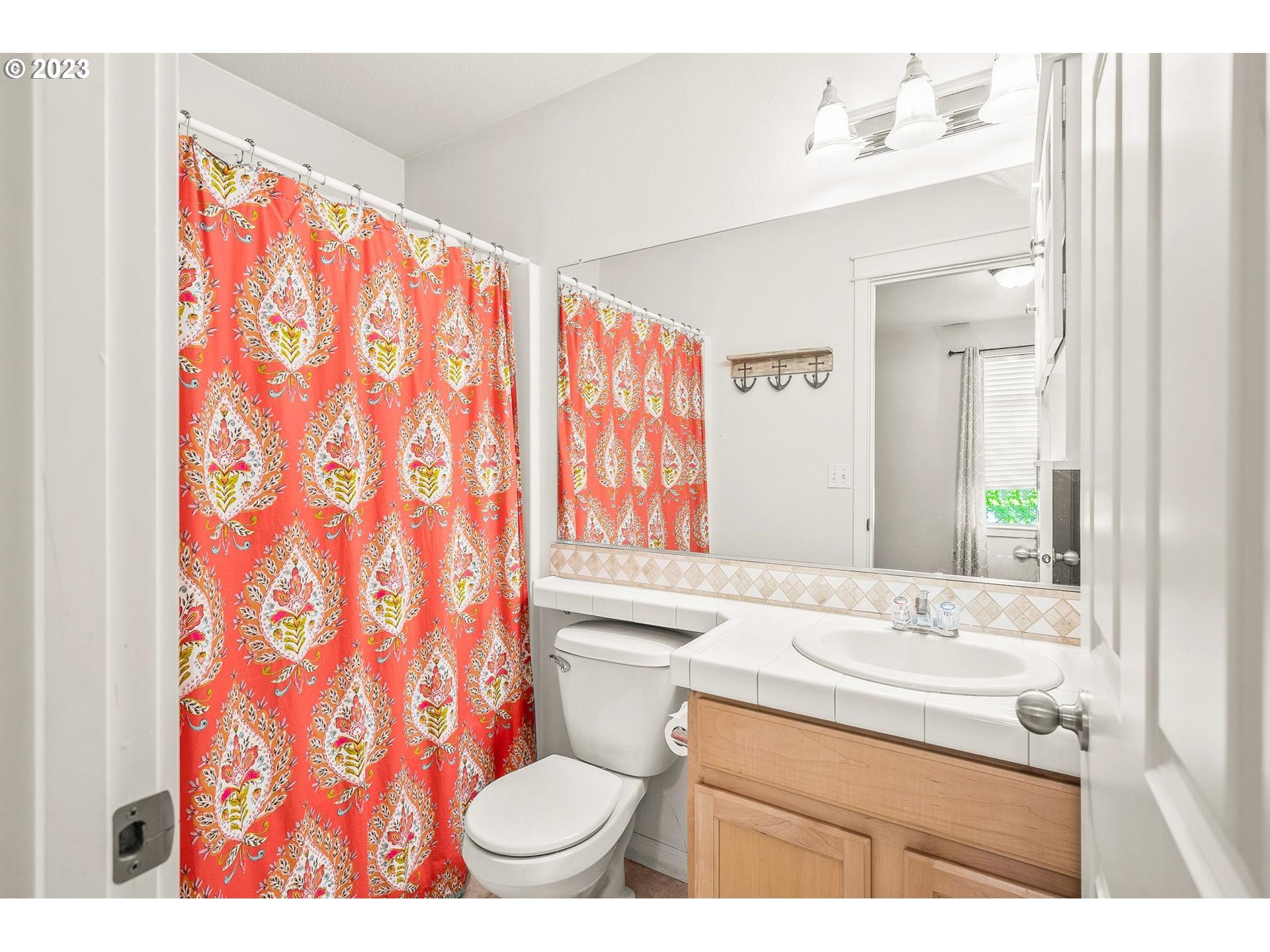 2830 Northeast Blossom Hill Road Fairview, OR 97024 - Photo 16 of 34 a bathroom with a sink toilet and shower