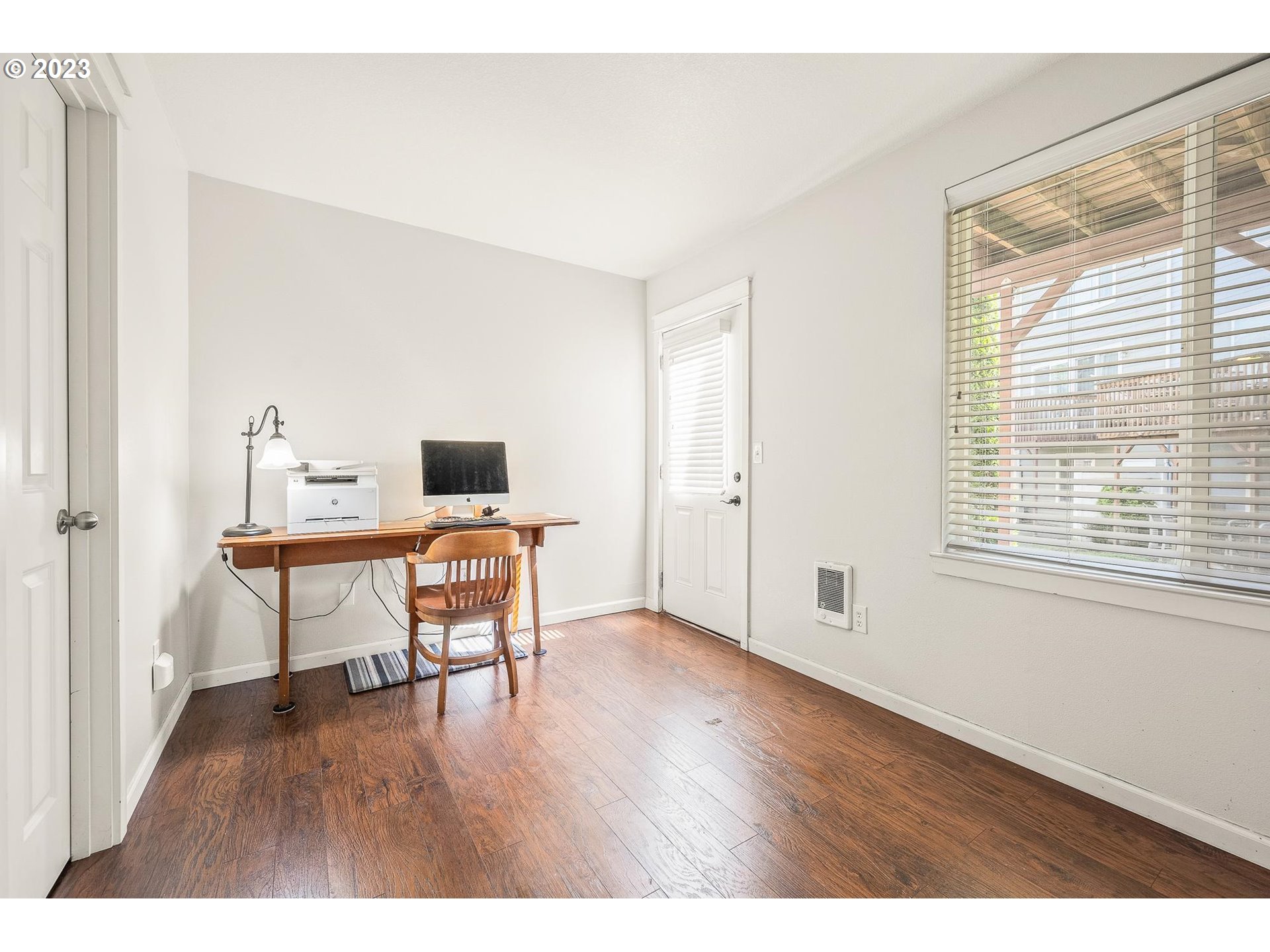 2830 Northeast Blossom Hill Road Fairview, OR 97024 - Photo 19 of 34 a workspace with furniture window and wooden floor
