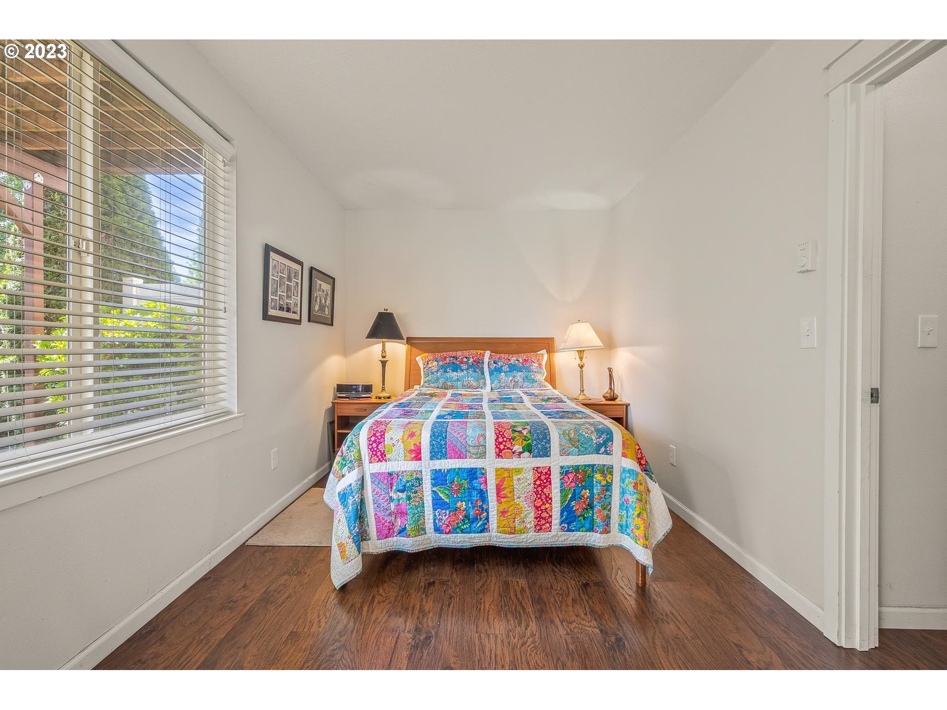 2830 Northeast Blossom Hill Road Fairview, OR 97024 - Photo 20 of 34 a bedroom with a bed next to a window