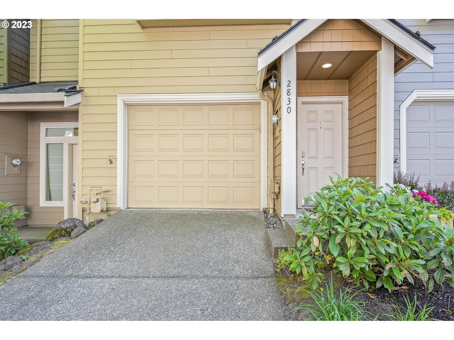 2830 Northeast Blossom Hill Road Fairview, OR 97024 - Photo 2 of 34 a front view of a house with a yard and garage