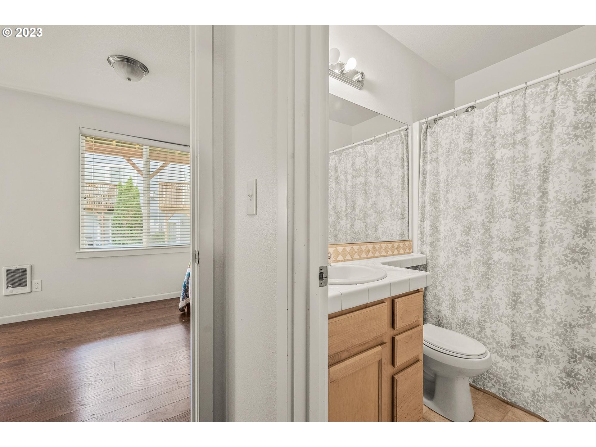 2830 Northeast Blossom Hill Road Fairview, OR 97024 - Photo 21 of 34 a bathroom with a granite countertop sink a toilet and a shower