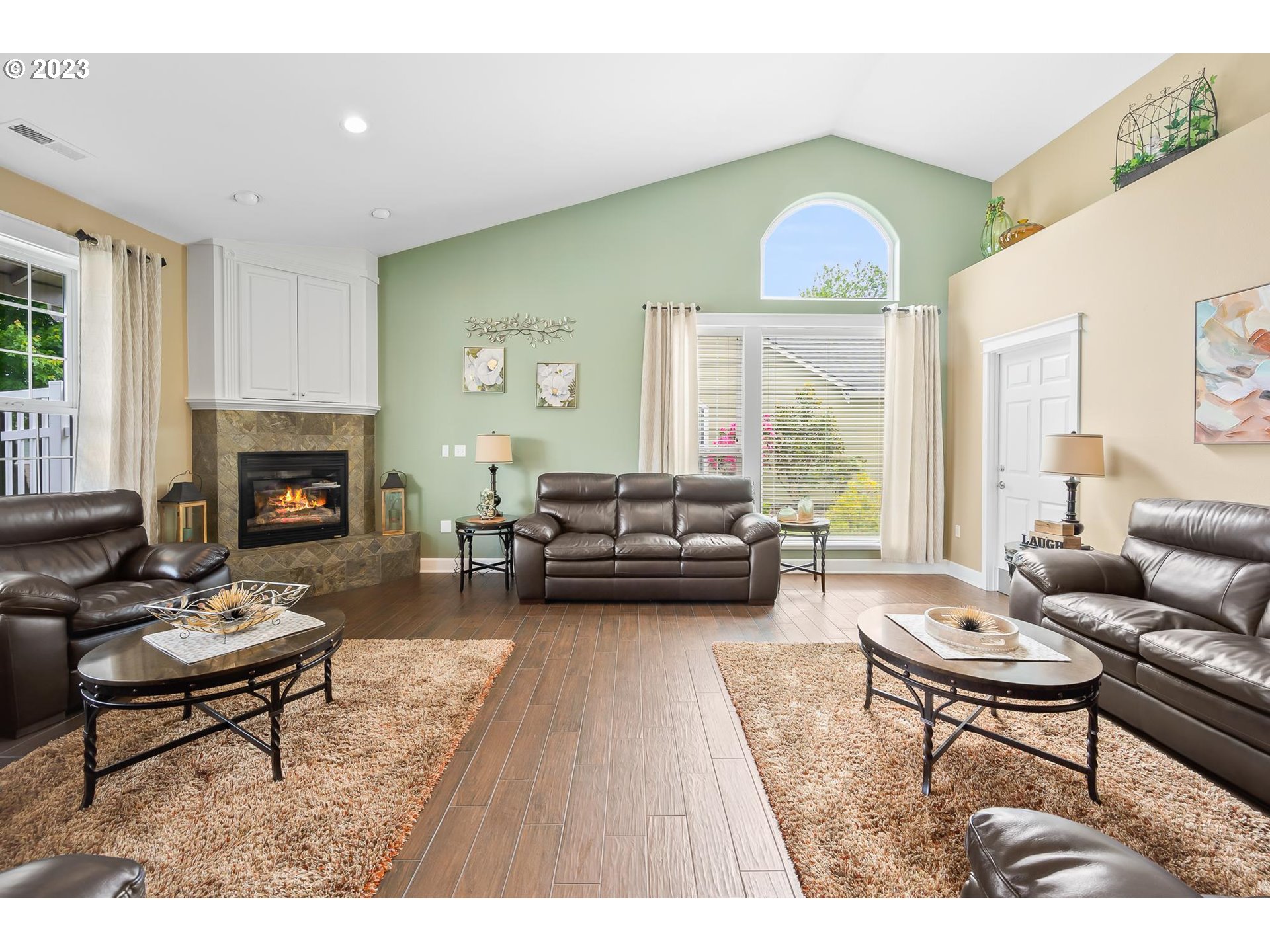 2830 Northeast Blossom Hill Road Fairview, OR 97024 - Photo 28 of 34 a living room with furniture fireplace and a large window