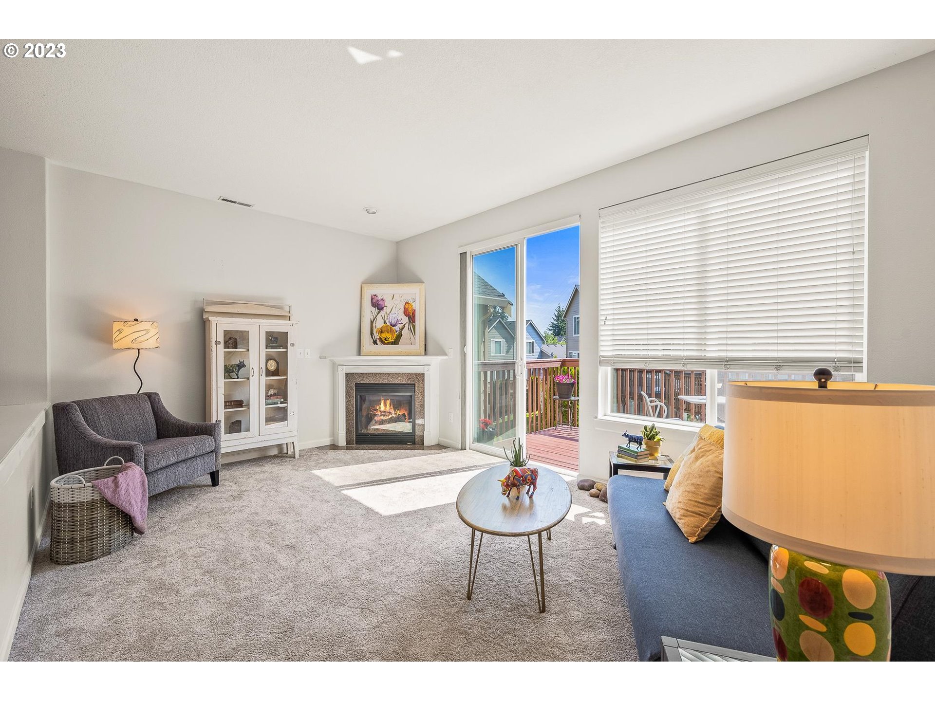 2830 Northeast Blossom Hill Road Fairview, OR 97024 - Photo 3 of 34 a living room with furniture a fireplace and a table
