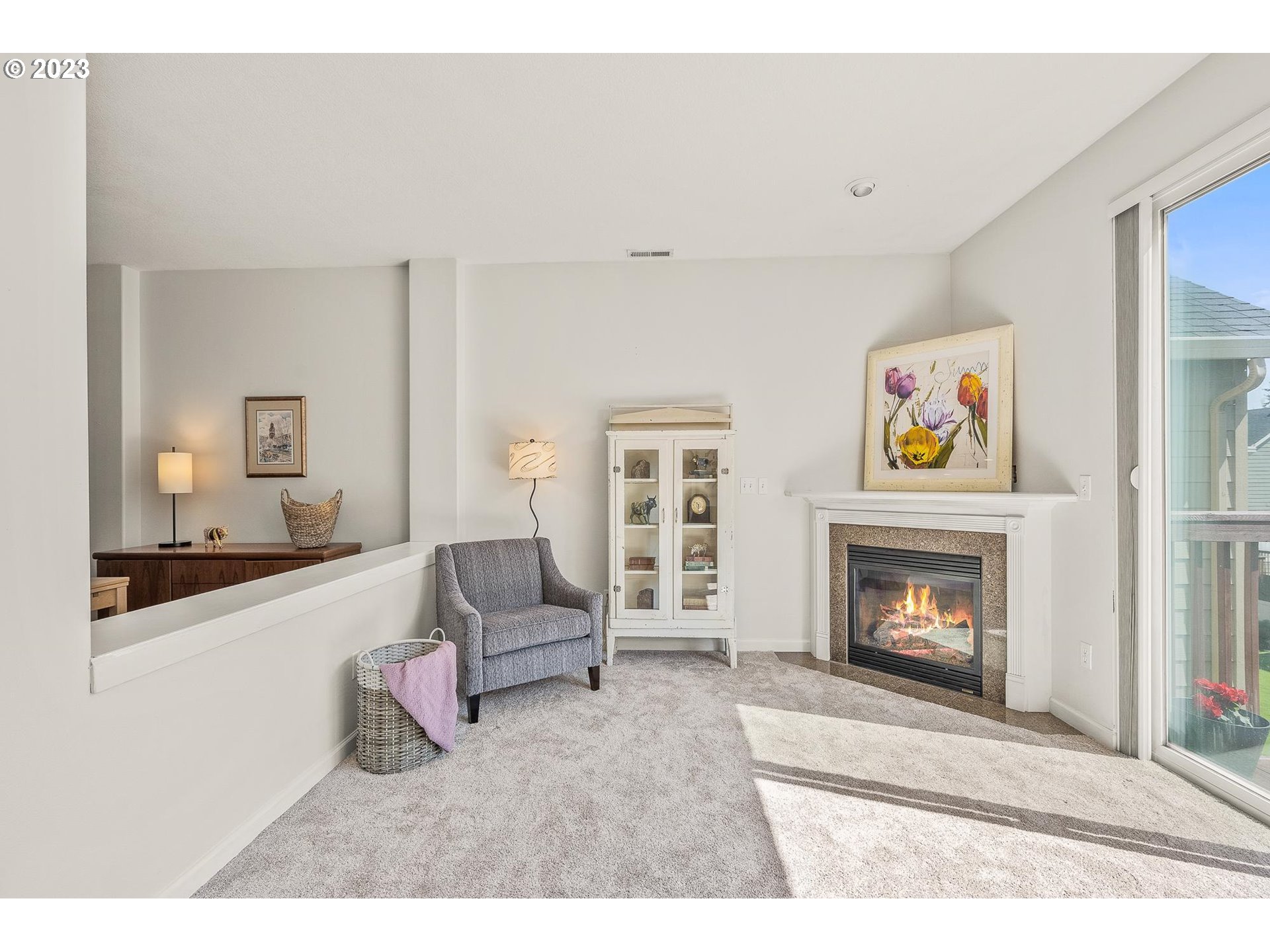 2830 Northeast Blossom Hill Road Fairview, OR 97024 - Photo 4 of 34 a living room with furniture and a fireplace