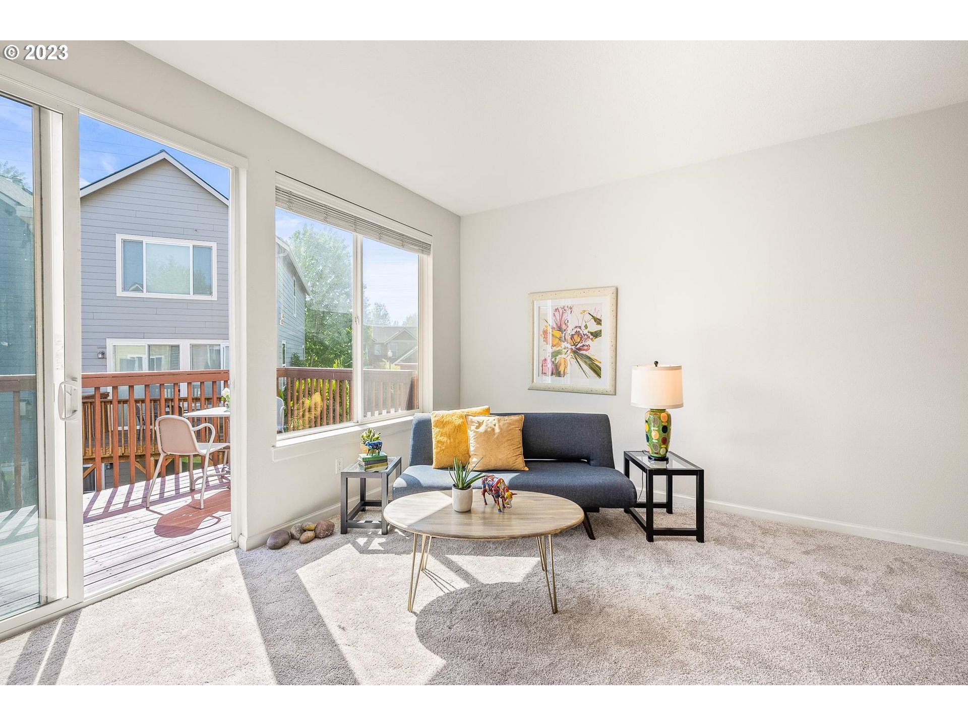 2830 Northeast Blossom Hill Road Fairview, OR 97024 - Photo 5 of 34 a living room with furniture and a floor to ceiling window