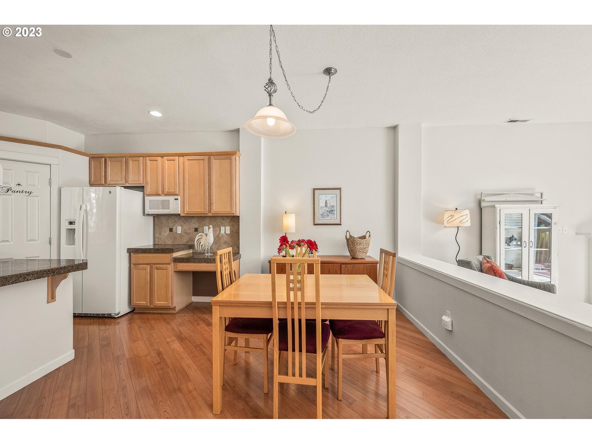 2830 Northeast Blossom Hill Road Fairview, OR 97024 - Photo 6 of 34 a view of a dining room kitchen with a table and chairs