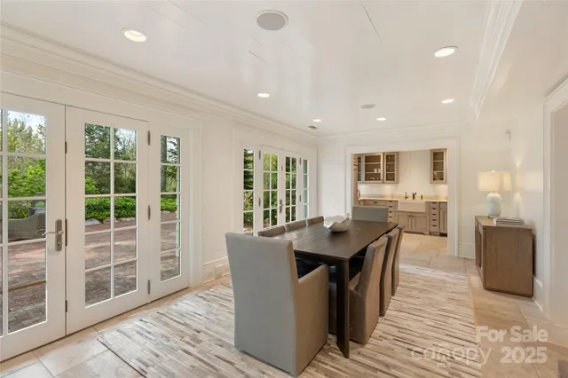 a dining room with a table and chairs