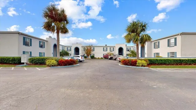a group of cars parked in front of a house