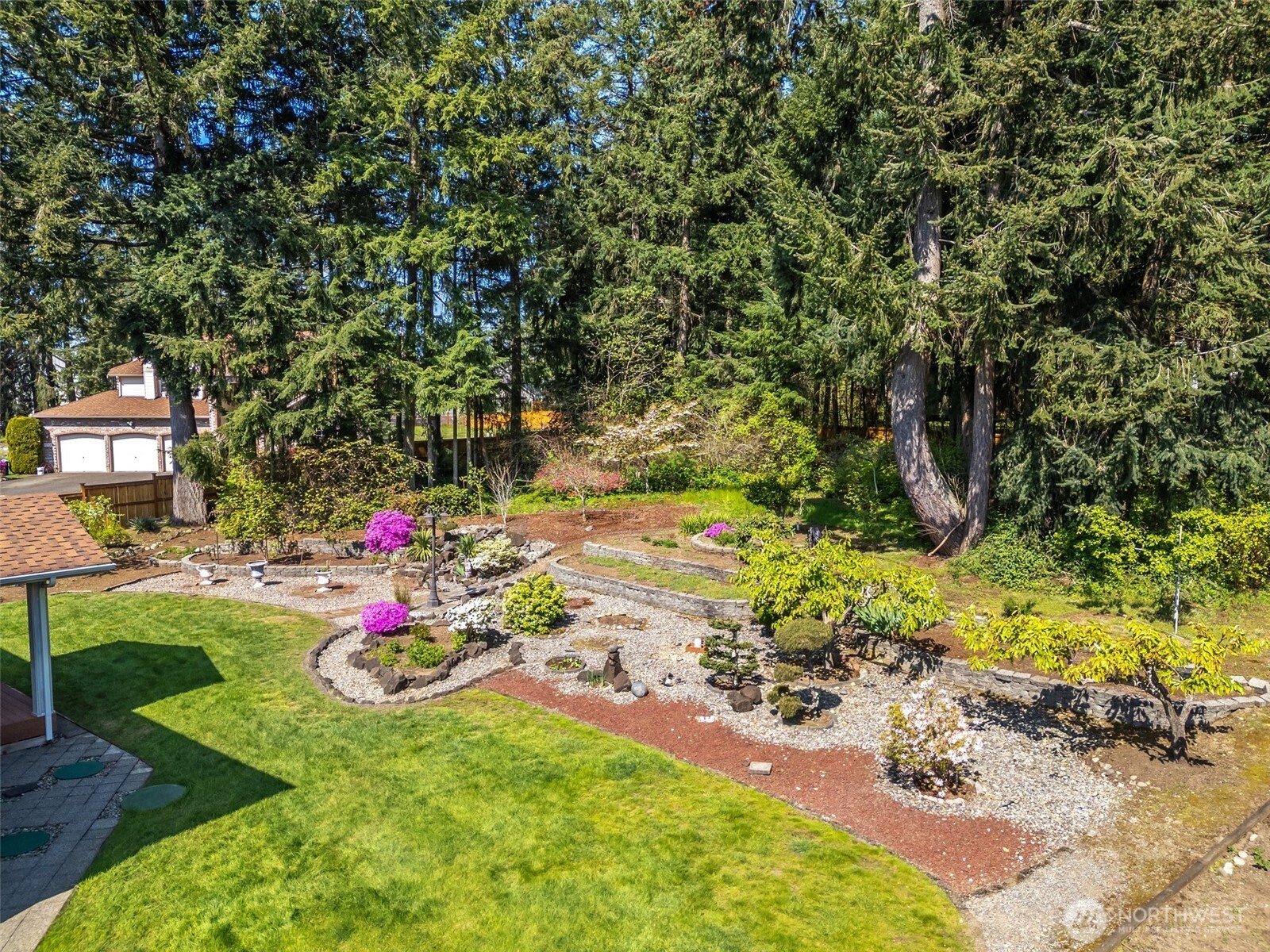9536 Marlbrook Loop Southeast Olympia, WA 98513 - Photo 12 of 40 a view of a garden with plants and seating area
