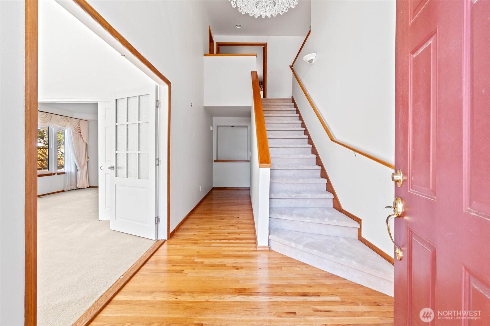 9536 Marlbrook Loop Southeast Olympia, WA 98513 - Photo 14 of 40 a view of a hallway with wooden floor and staircase