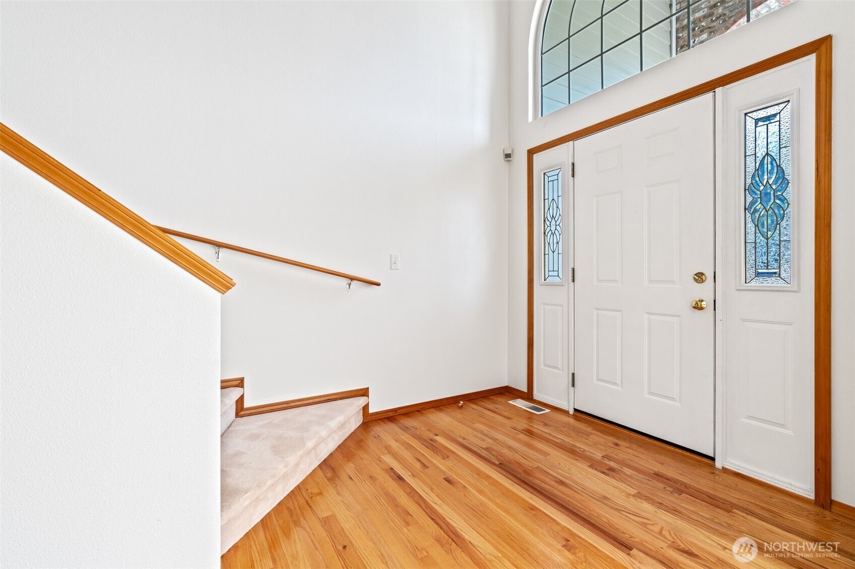 9536 Marlbrook Loop Southeast Olympia, WA 98513 - Photo 15 of 40 a view of a bedroom with wooden floor and stairs