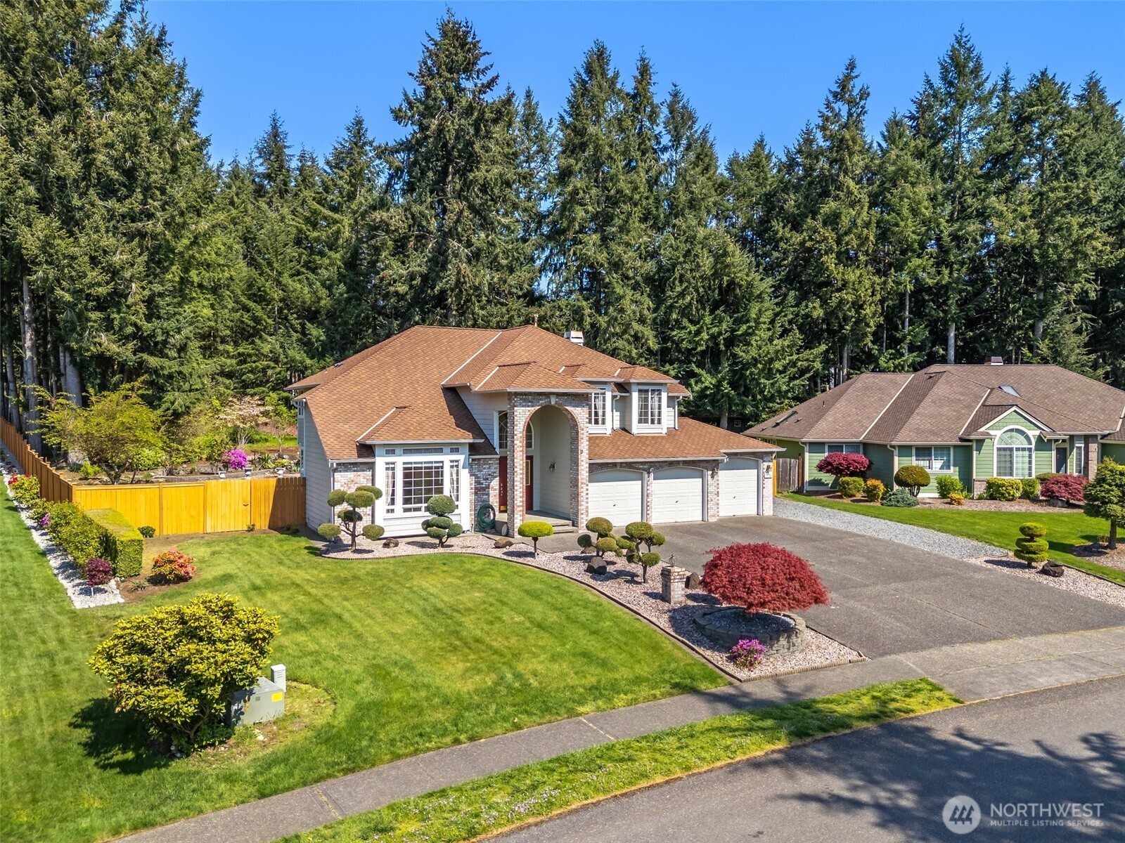 9536 Marlbrook Loop Southeast Olympia, WA 98513 - Photo 2 of 40 a front view of a house with garden