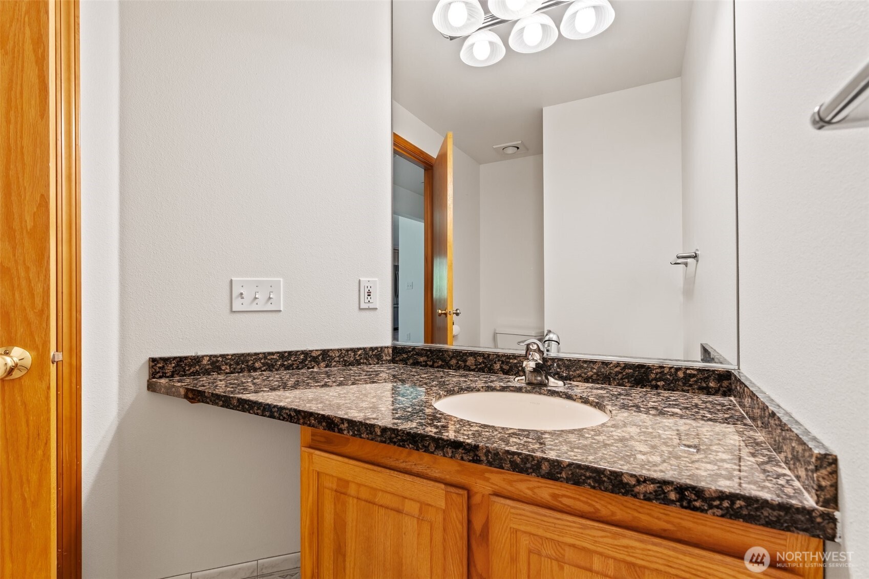9536 Marlbrook Loop Southeast Olympia, WA 98513 - Photo 28 of 40 a bathroom with a granite countertop sink and a mirror