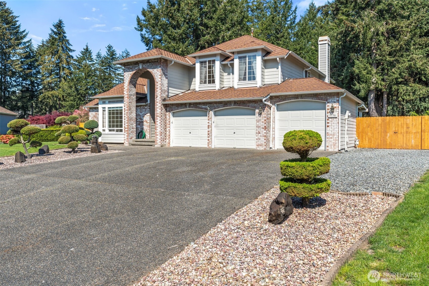 9536 Marlbrook Loop Southeast Olympia, WA 98513 - Photo 3 of 40 a front view of a house with a garden and outdoor seating