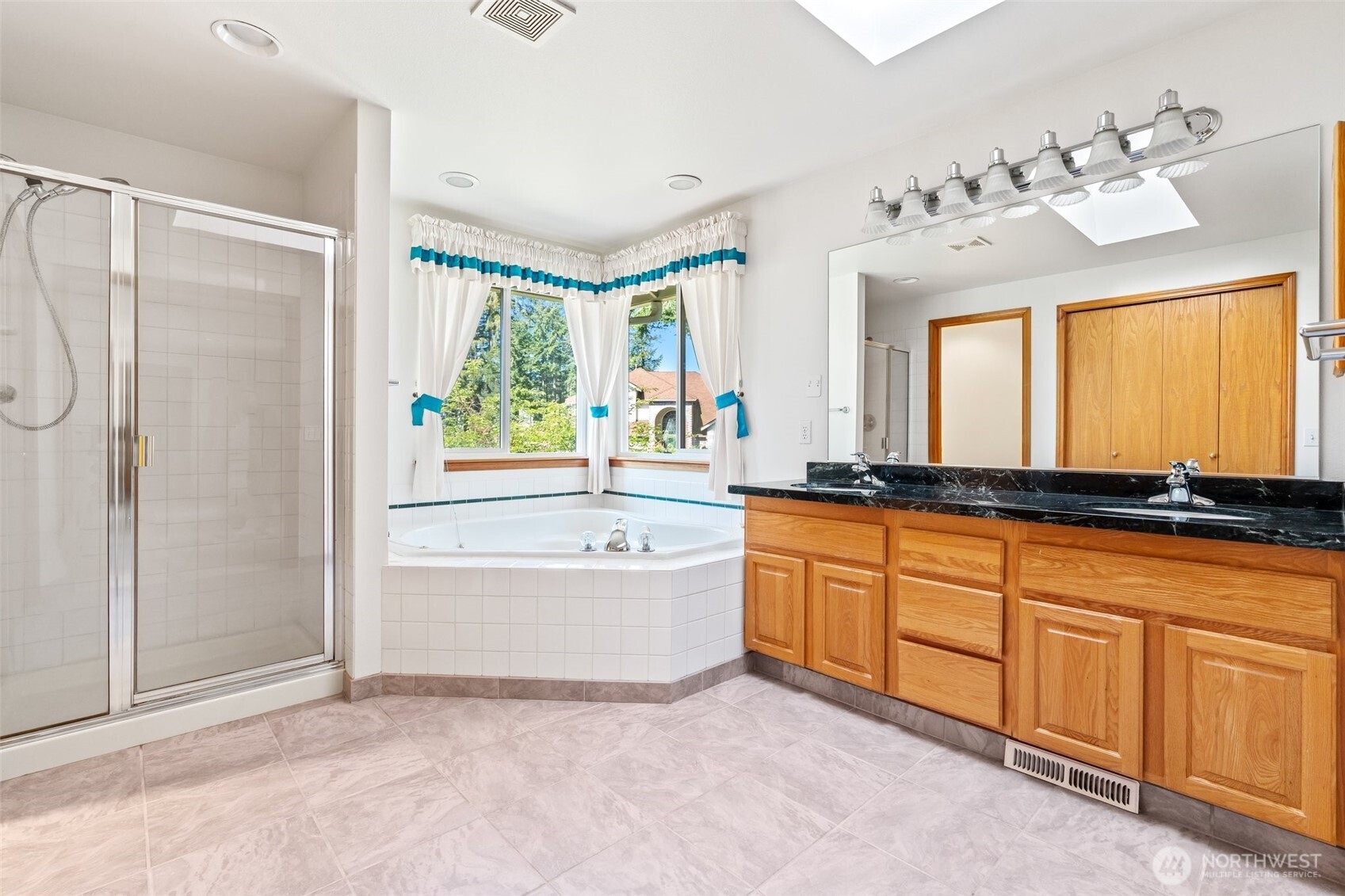 9536 Marlbrook Loop Southeast Olympia, WA 98513 - Photo 32 of 40 a bathroom with a tub sink and mirror