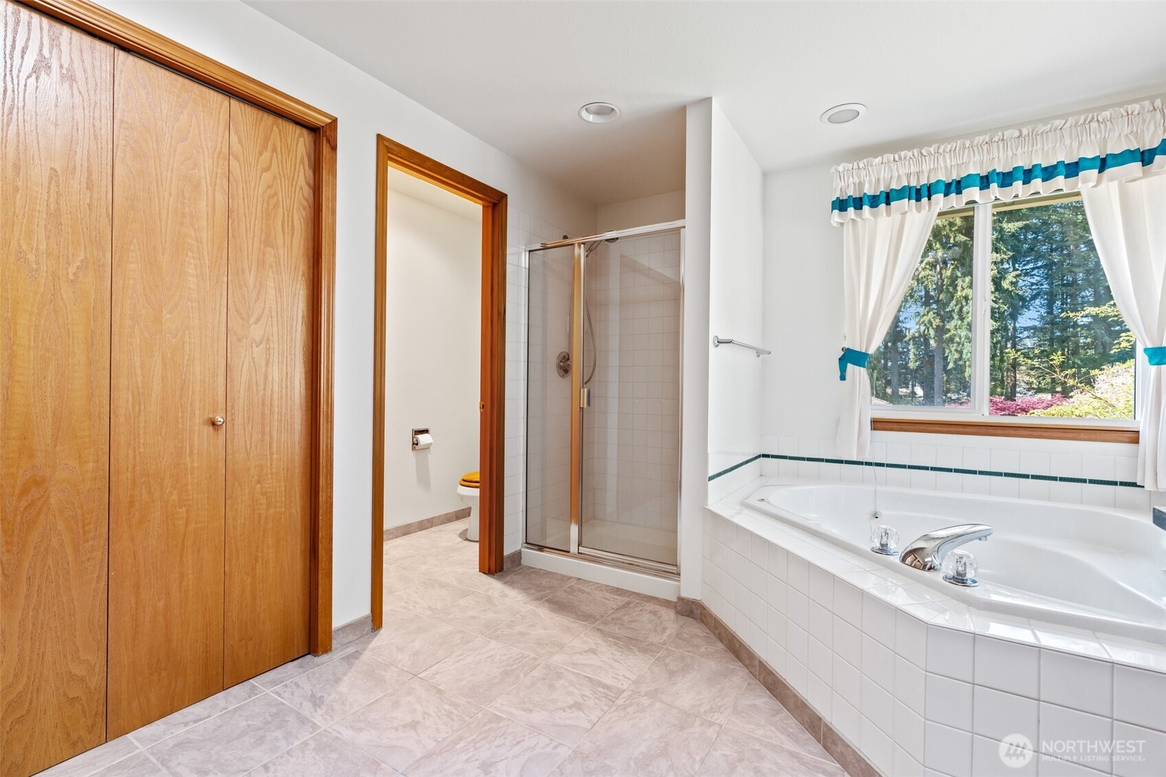 9536 Marlbrook Loop Southeast Olympia, WA 98513 - Photo 33 of 40 a bathroom with a bathtub and a shower