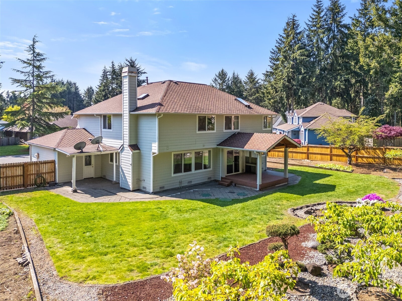 9536 Marlbrook Loop Southeast Olympia, WA 98513 - Photo 38 of 40 a view of a house with a yard patio and swimming pool