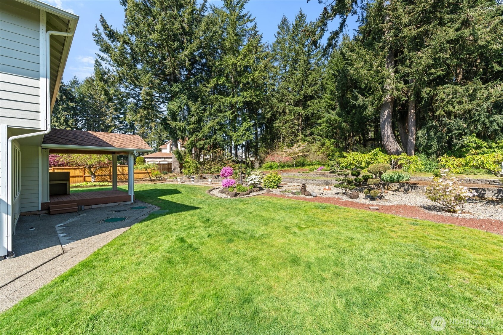 9536 Marlbrook Loop Southeast Olympia, WA 98513 - Photo 9 of 40 a view of backyard with table and chairs and potted plants