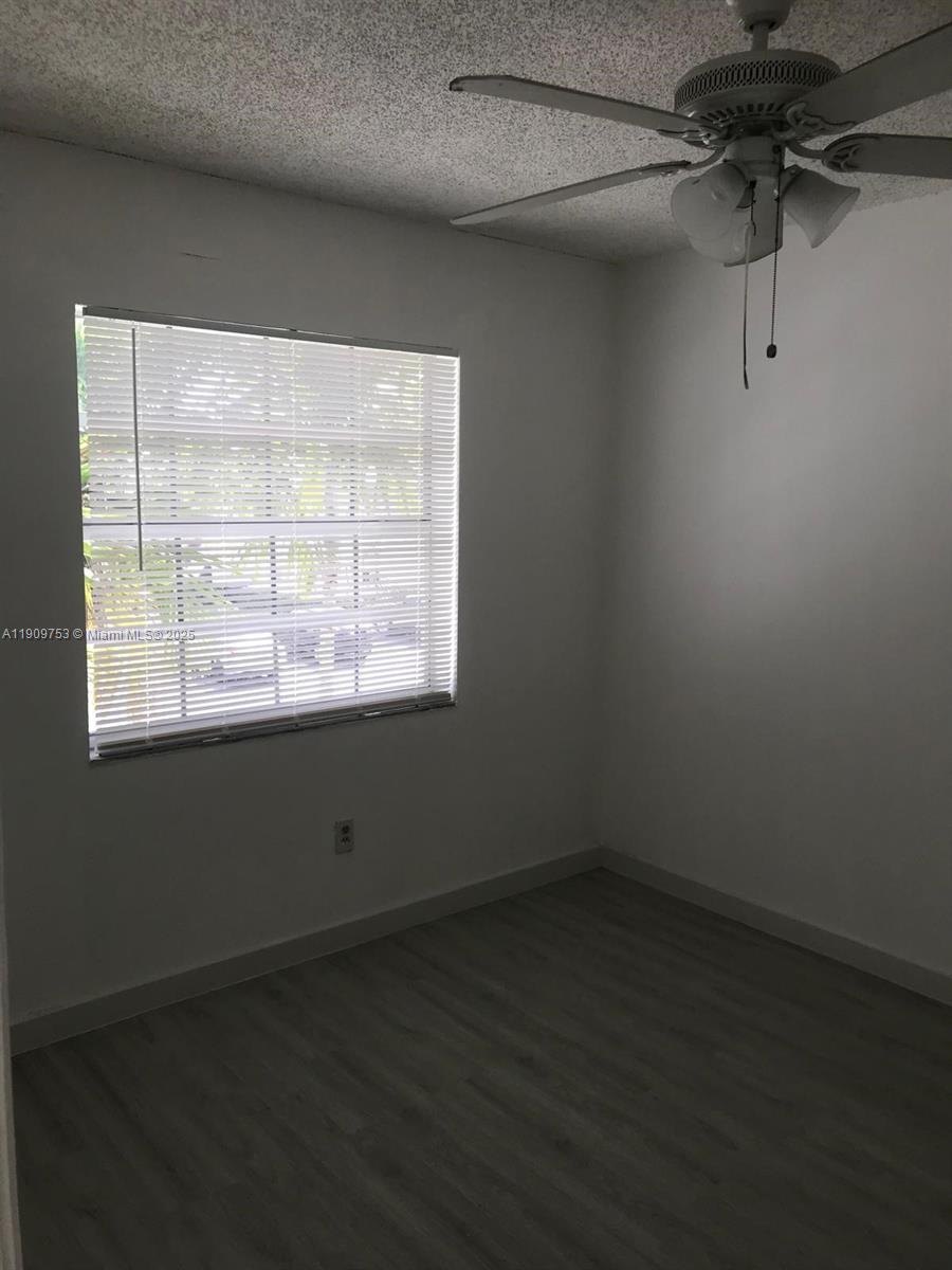438 Northeast 210th Cir Terrace, Unit 2034B Miami, FL 33179 - Photo 11 of 20 a view of a room that has a window in it