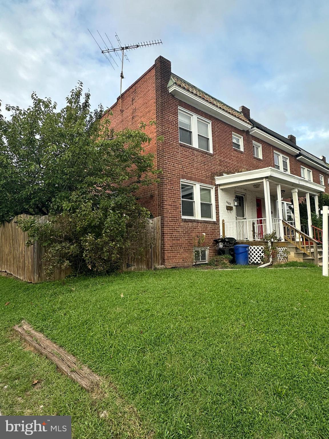 6822 Dunbar Road Baltimore, MD 21222 - Photo 1 of 20 a front view of a house with a yard