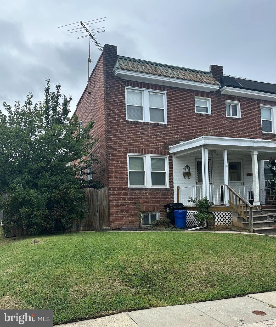 6822 Dunbar Road Baltimore, MD 21222 - Photo 2 of 20 a front view of a house with garden and porch