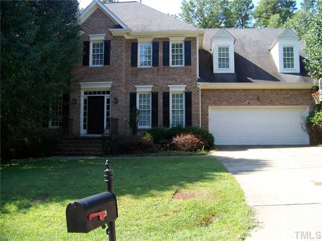 2629 Jasper Lane Raleigh, NC 27613 - Photo 1 of 7 a front view of a house with a yard and garage