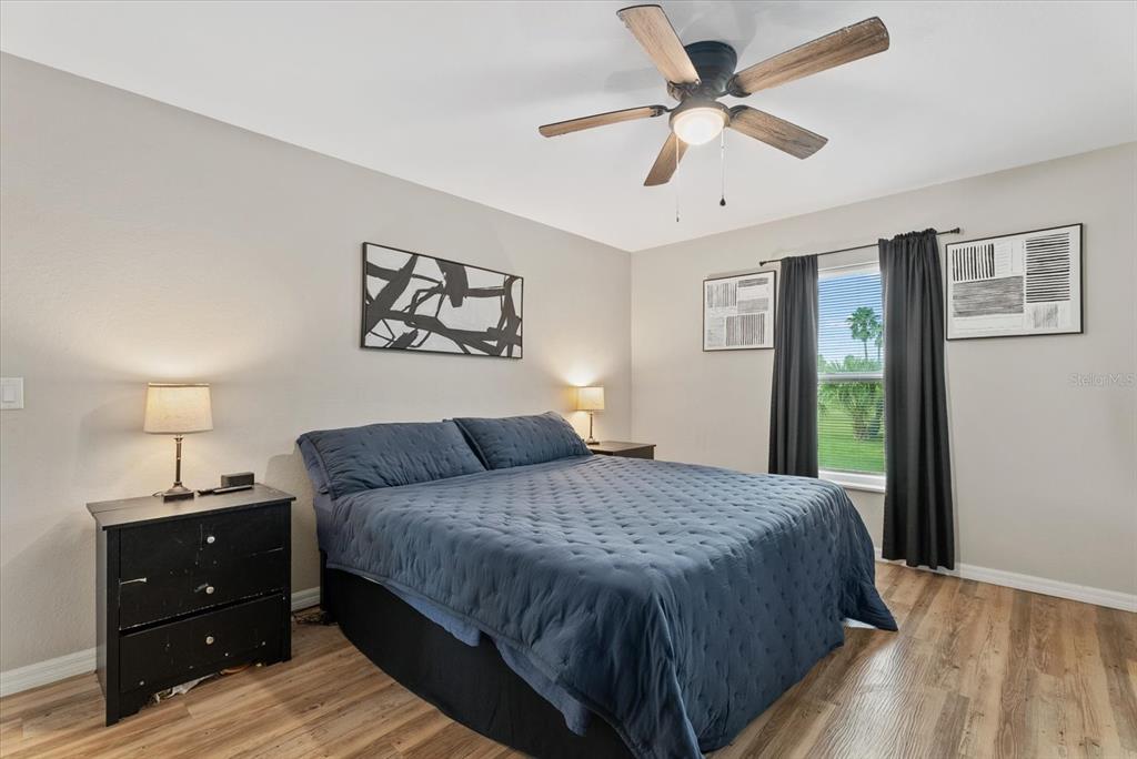 8288 Southwest Sunnybreeze Road Arcadia, FL 34269 - Photo 9 of 18 a bedroom with a large bed and a window