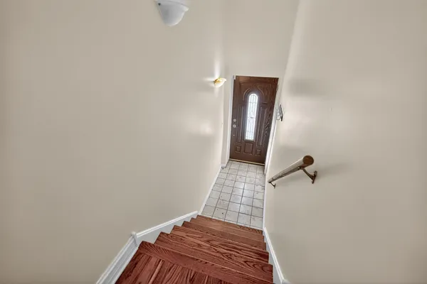 a view of hallway with a mirror