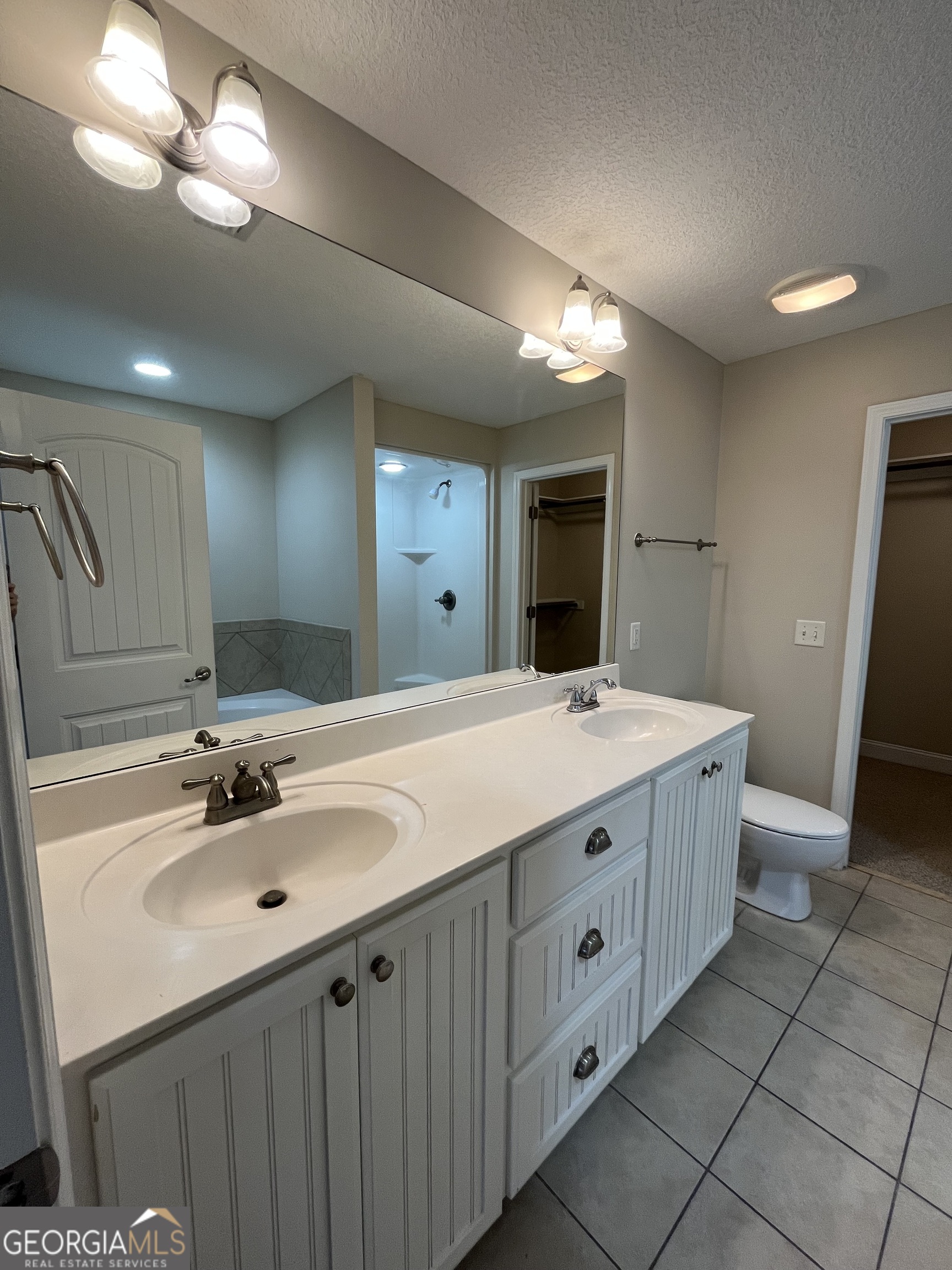 17 Fox Path St. Marys, GA 31558 - Photo 17 of 23 a bathroom with a double vanity sink and a mirror