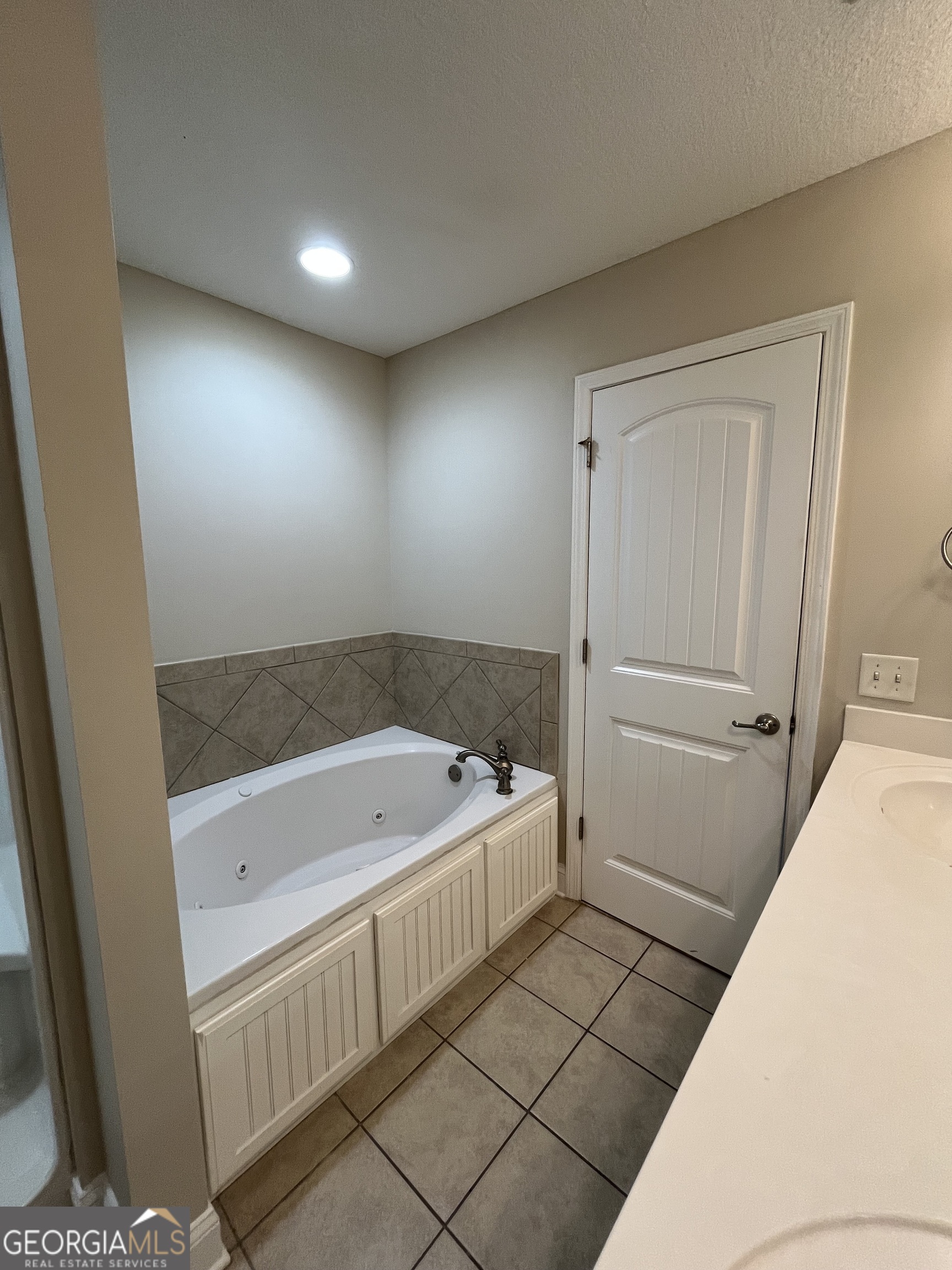 17 Fox Path St. Marys, GA 31558 - Photo 18 of 23 a bathroom with a tub and shower