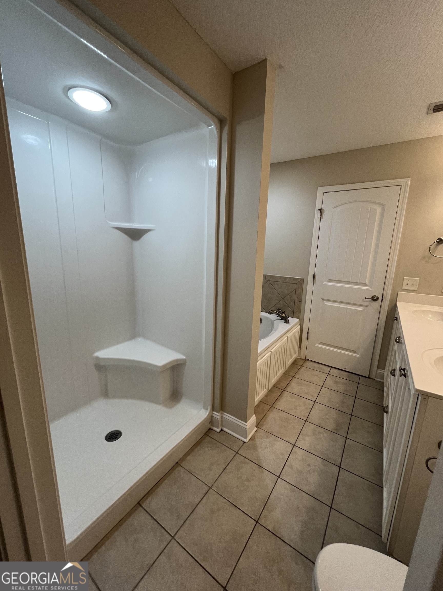 17 Fox Path St. Marys, GA 31558 - Photo 19 of 23 a bathroom with a sink and mirror