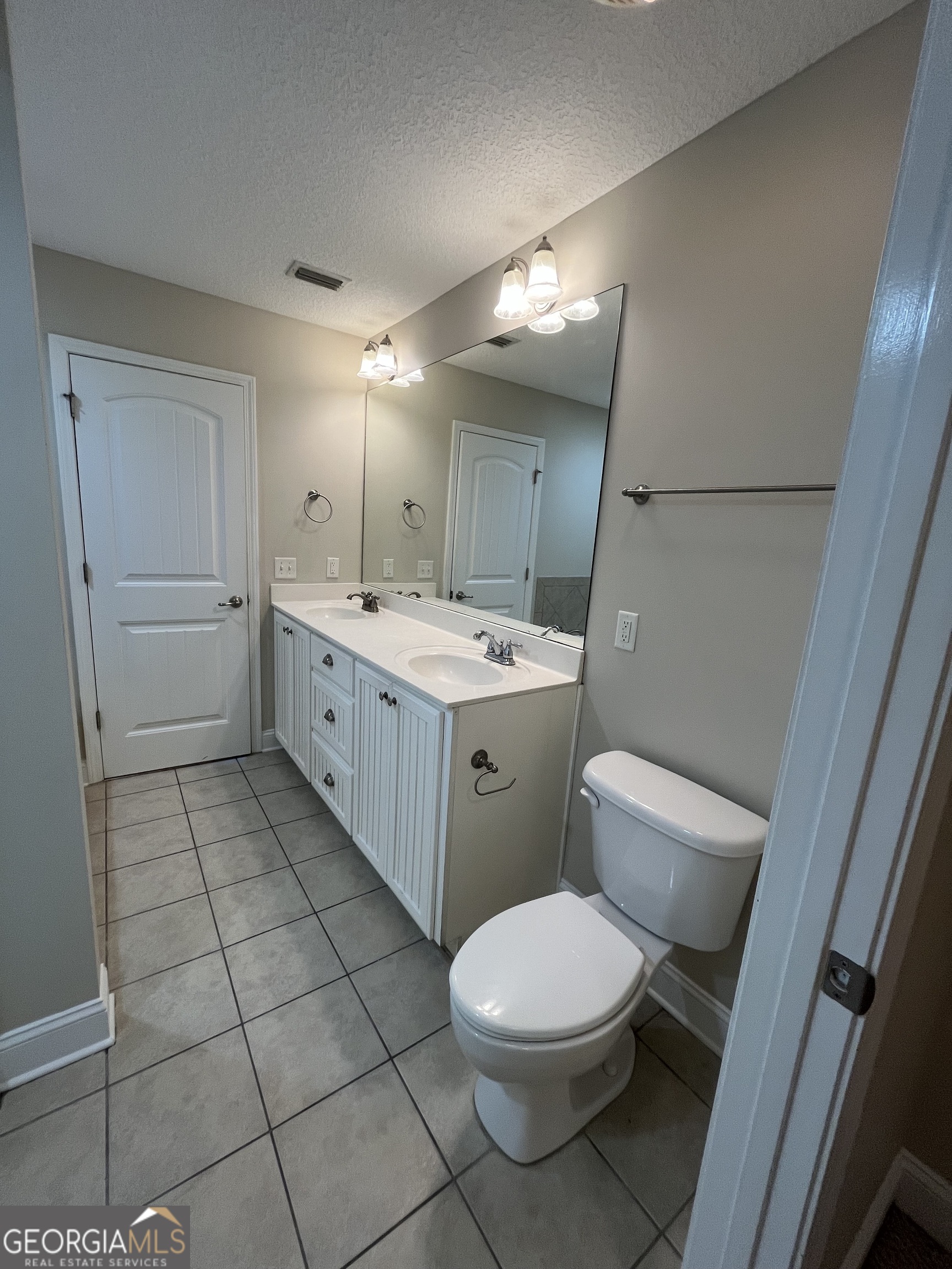 17 Fox Path St. Marys, GA 31558 - Photo 20 of 23 a bathroom with a toilet sink and mirror
