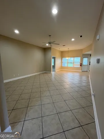 a view of an empty room and window