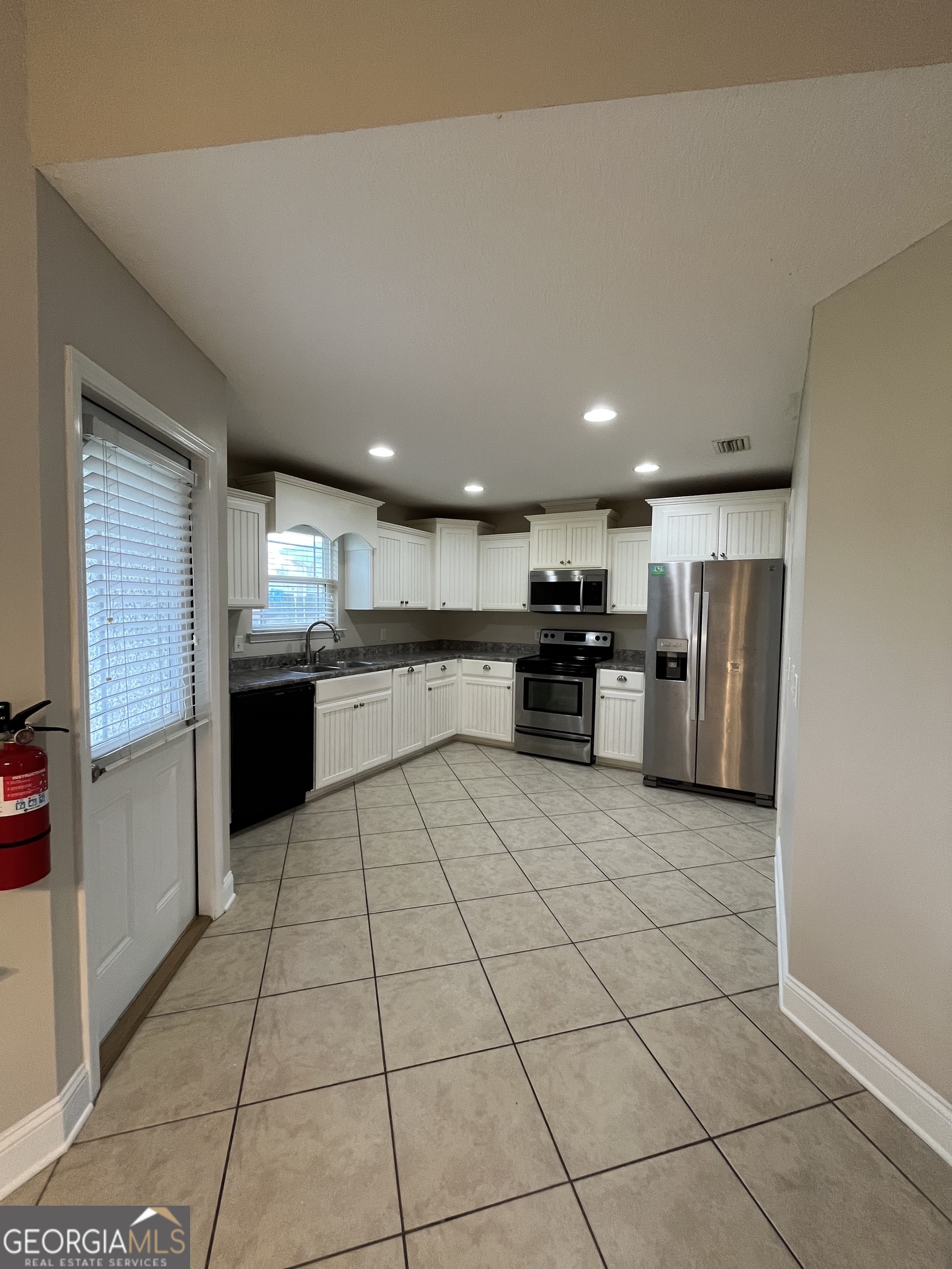 17 Fox Path St. Marys, GA 31558 - Photo 6 of 23 a kitchen with stainless steel appliances granite countertop a refrigerator and a stove top oven