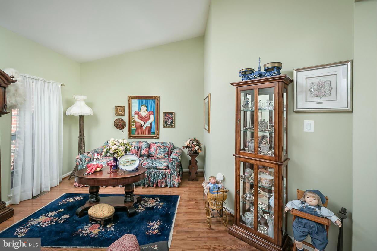 8605 Snowreath Road, Unit 8605 Pikesville, MD 21208 - Photo 12 of 30 High ceilings and more wood floors.