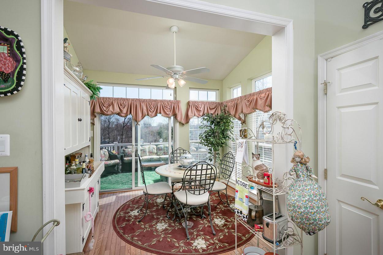 8605 Snowreath Road, Unit 8605 Pikesville, MD 21208 - Photo 7 of 30 Bright Sun Room With sliders to deck.